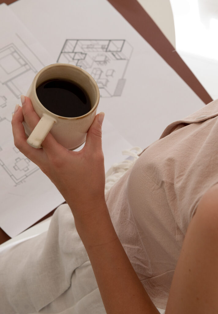 Interior designer reviewing a home design plan with client.